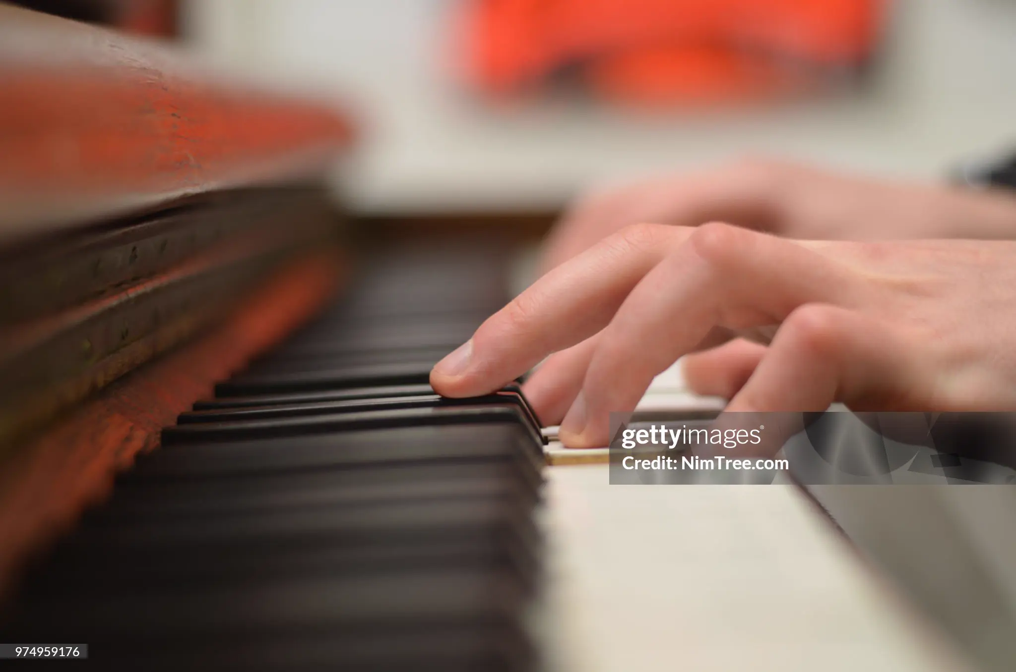 Piano keys close-up with sheet music on a music stand